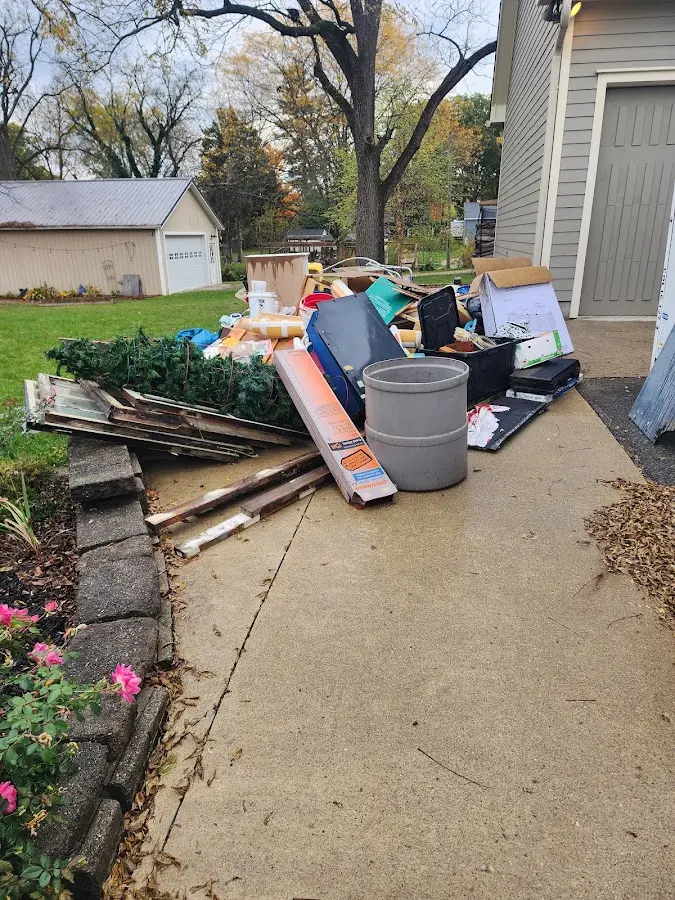Dumpster being loaded with debris for Estate Cleanout Dumpster Rental in Salem